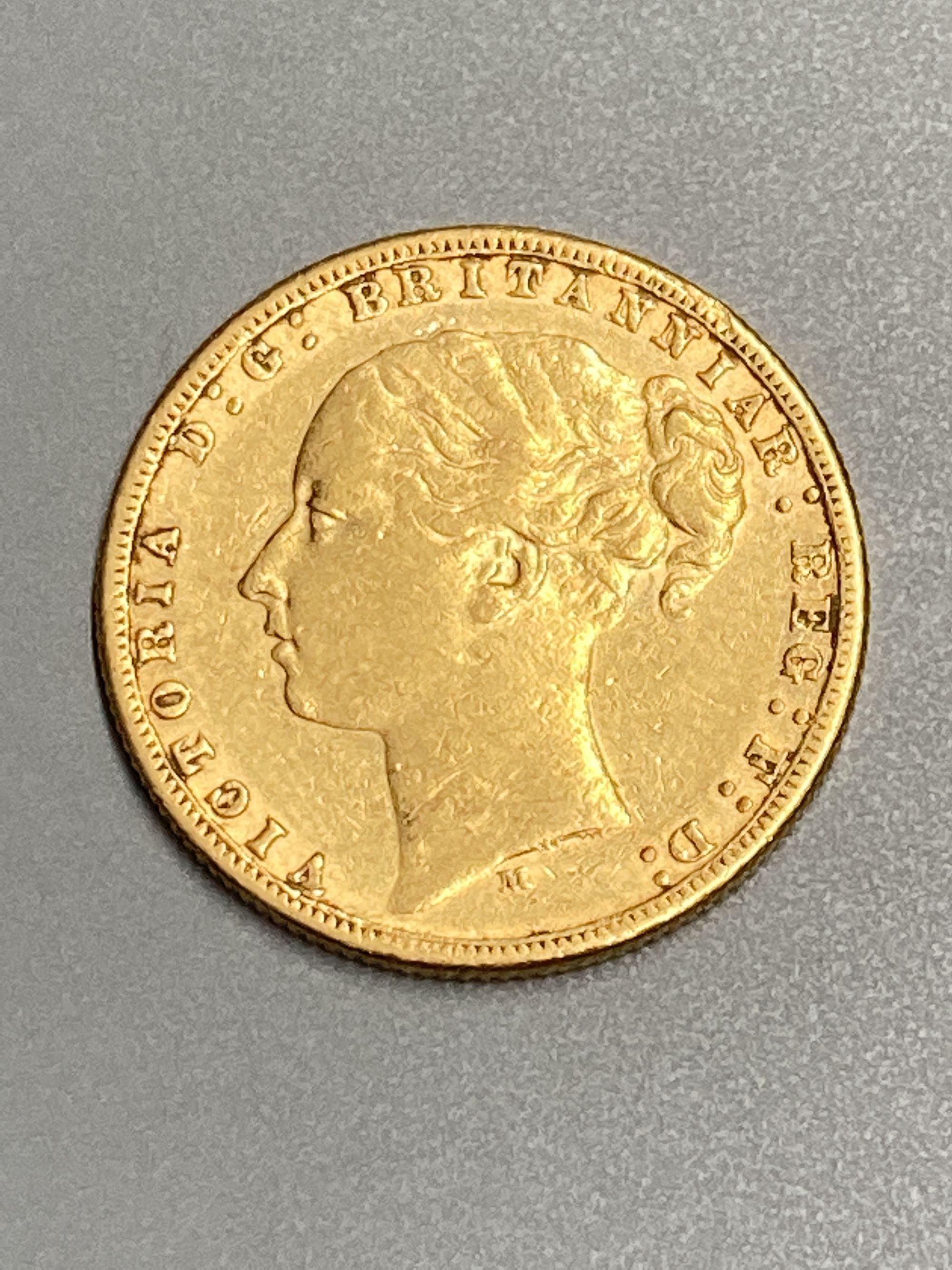 A Victoria 1876M gold sovereign, AVF.